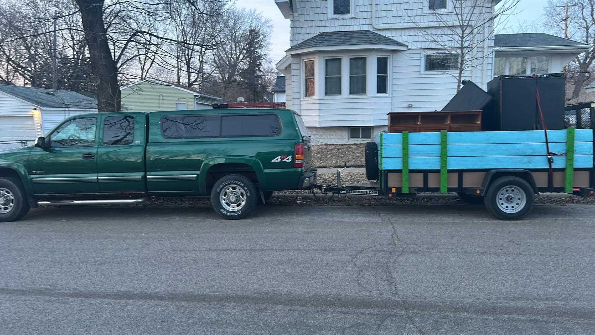 El Flee's Junk Removal truck parked outside a Minnesota home